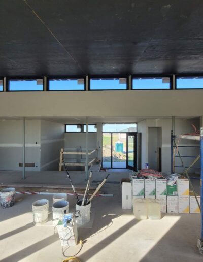 Drywall Installation Perfectly done in great room along walls. Drywall and taping in a new house.