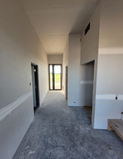 Drywall Installation Perfectly done in hallway. Drywall and taping in a new house.