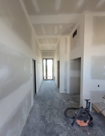Perfectly done Drywall Installation In Hallway. Drywall and taping in a new house.