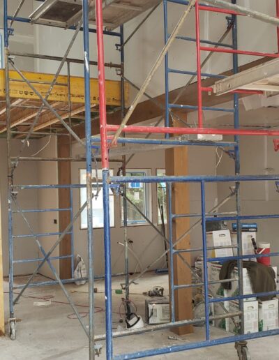 Drywall Installation Perfectly done with a builder walking. Drywall and taping in a new house.